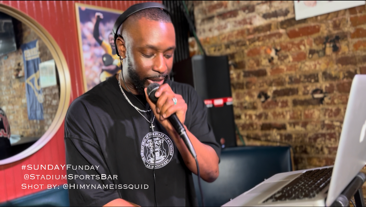 a man sitting at a table using a laptop