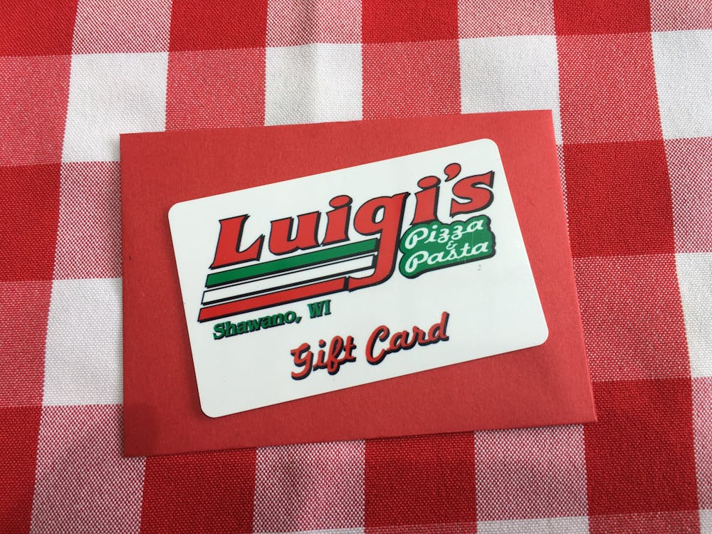 a close up of luigis pizza and pasta gift card