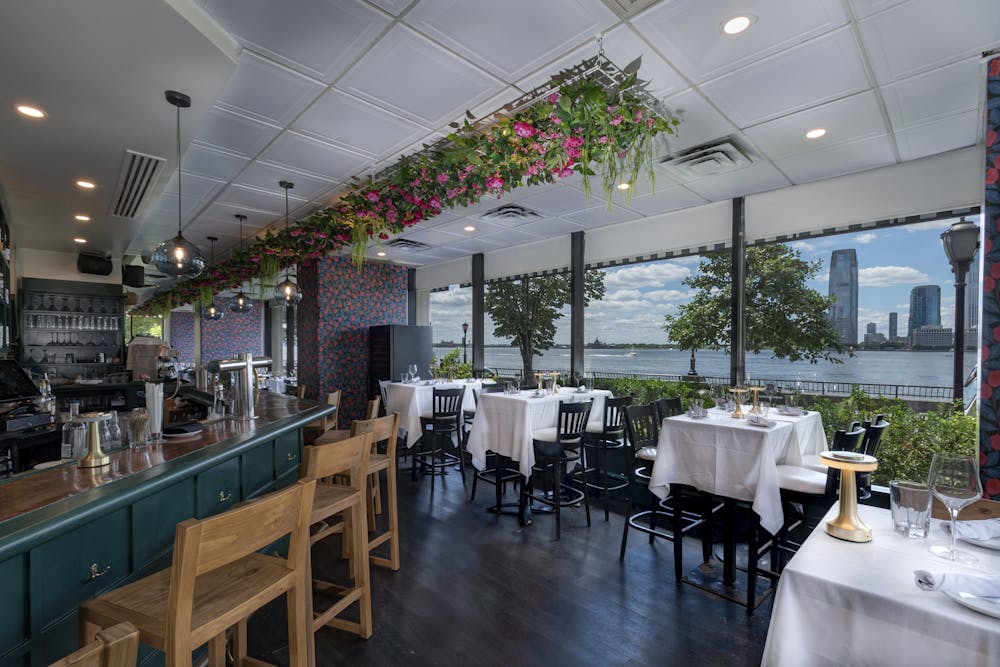 A dining room table with views of the Statue of Liberty