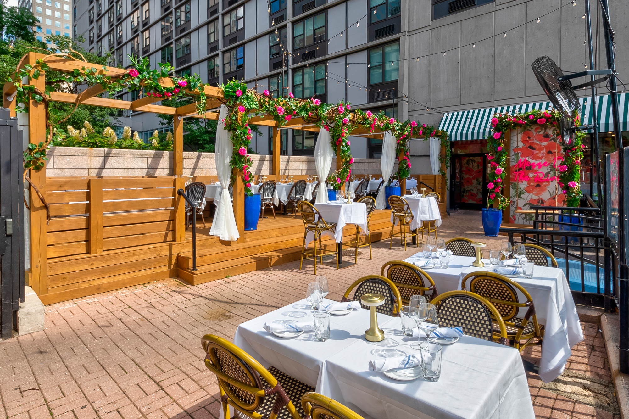 Outdoor waterfront seating at Mezze on the River overlooking the Hudson