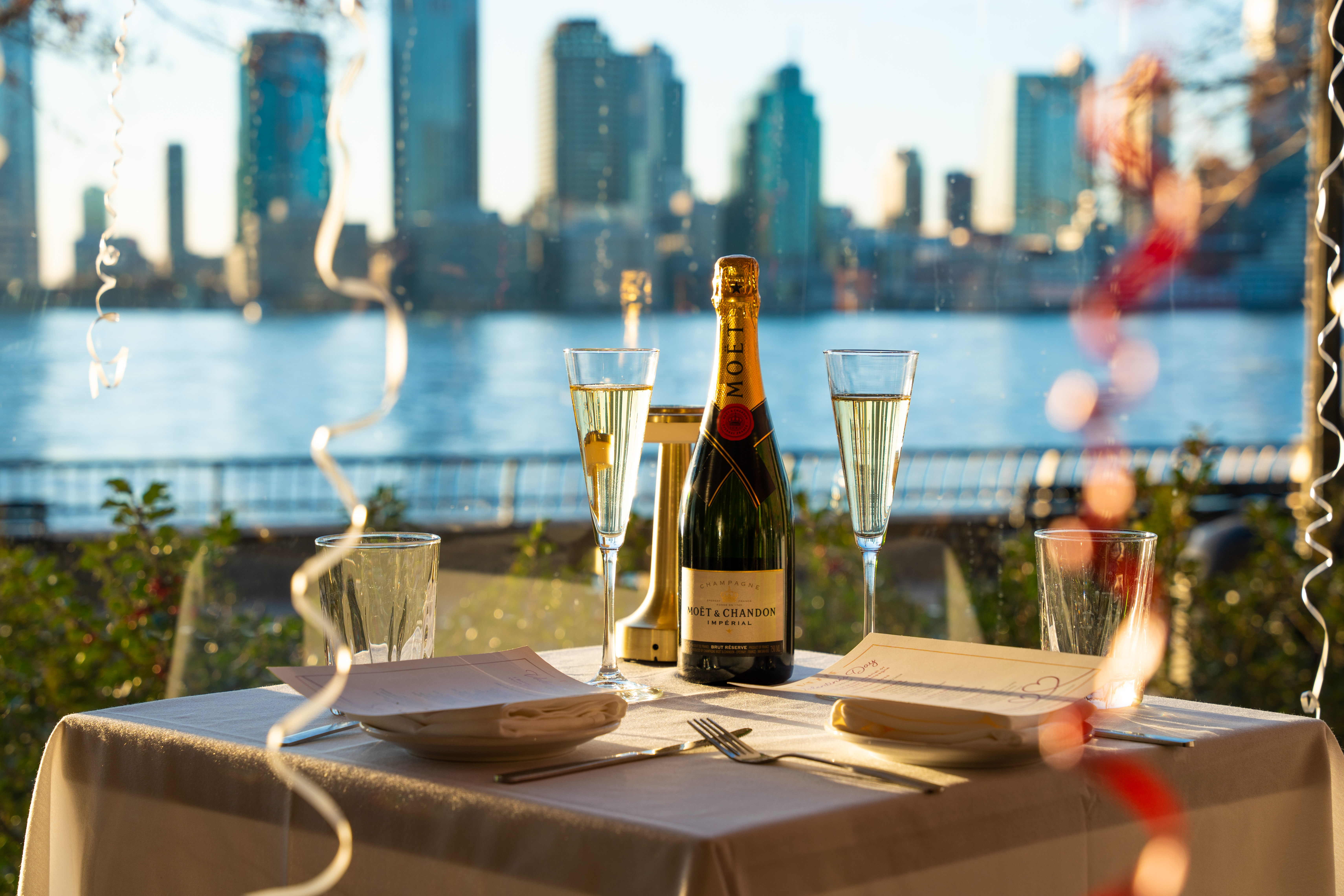 Candlelit table by the river for a romantic evening