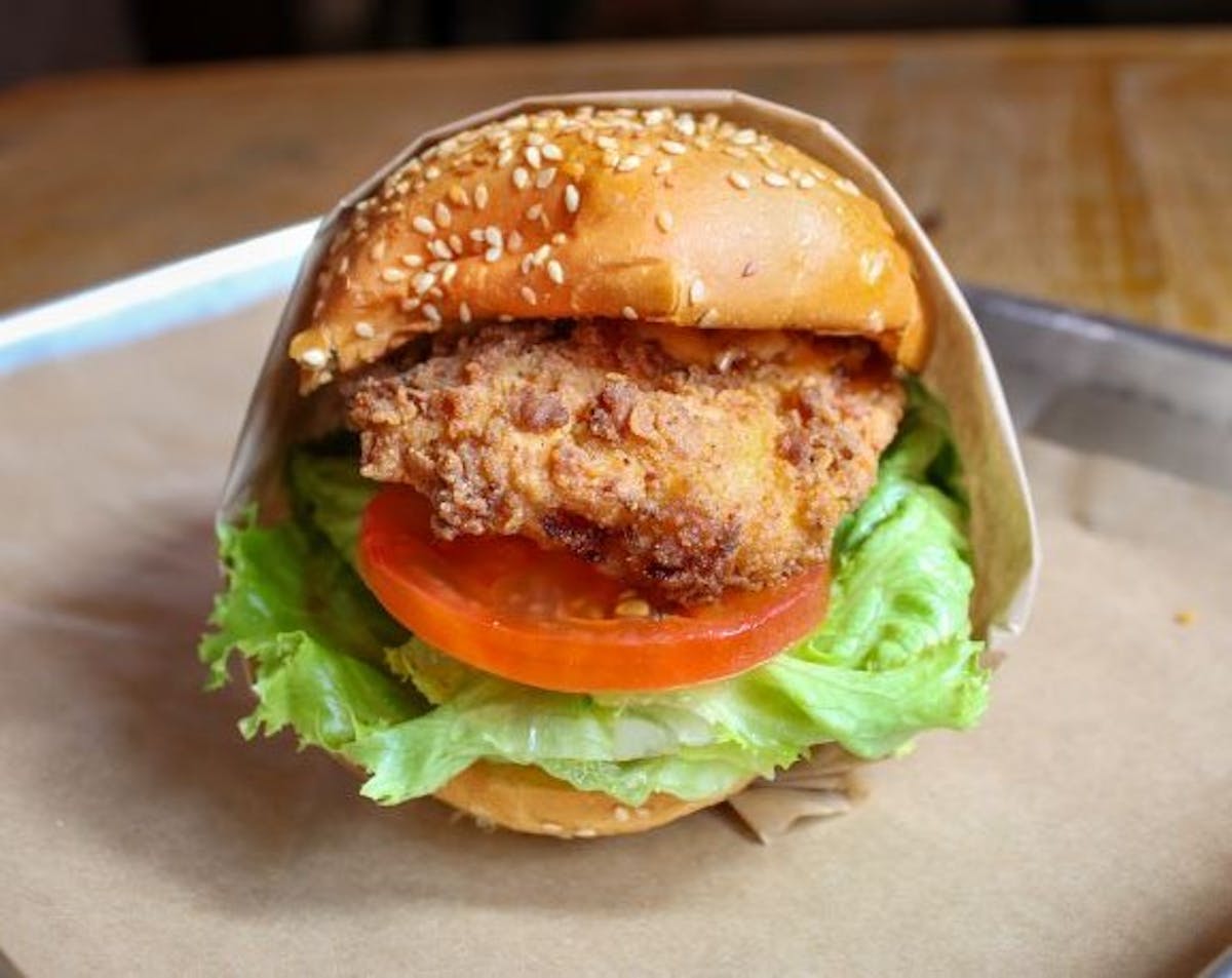 a close up of a sandwich sitting on top of a wooden table