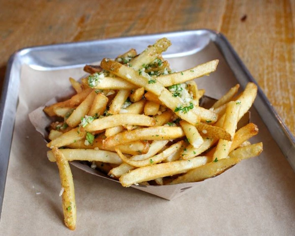 a sandwich and fries on a tray