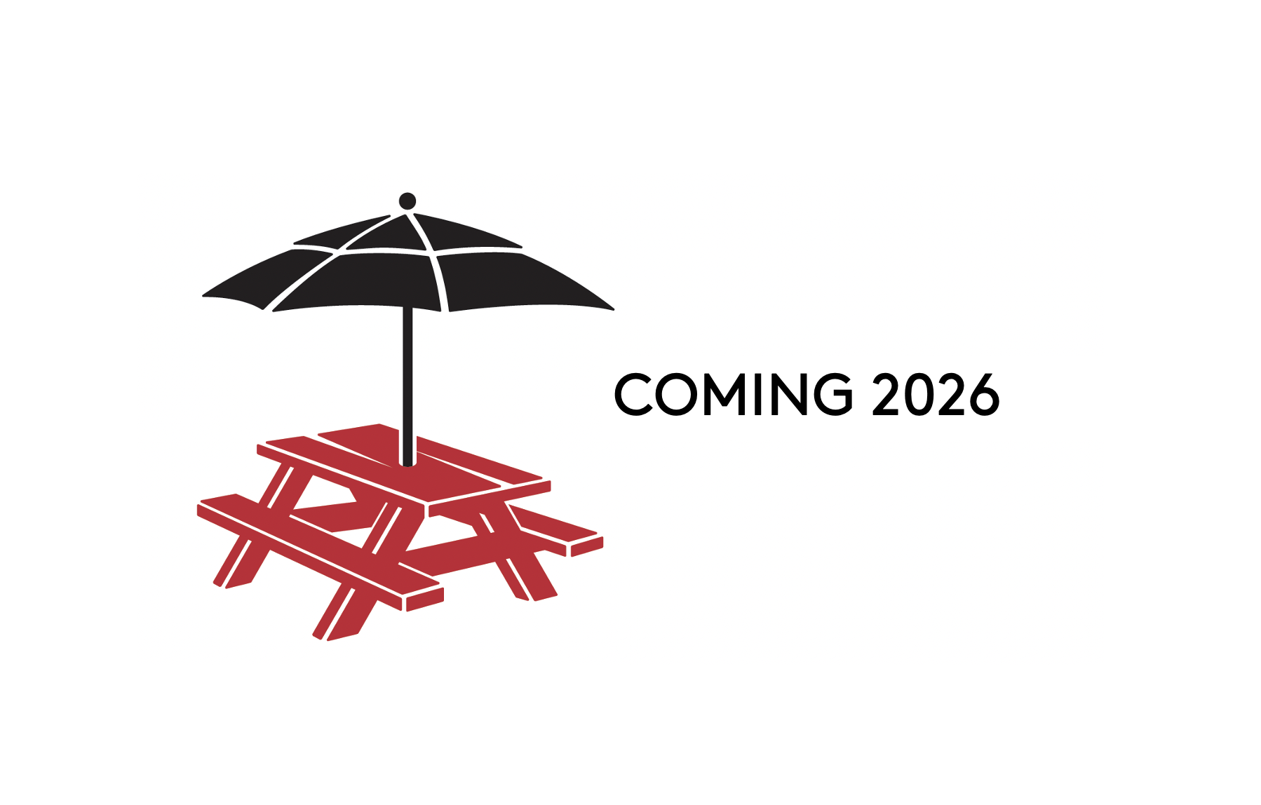 a red picnic table with a black umbrella