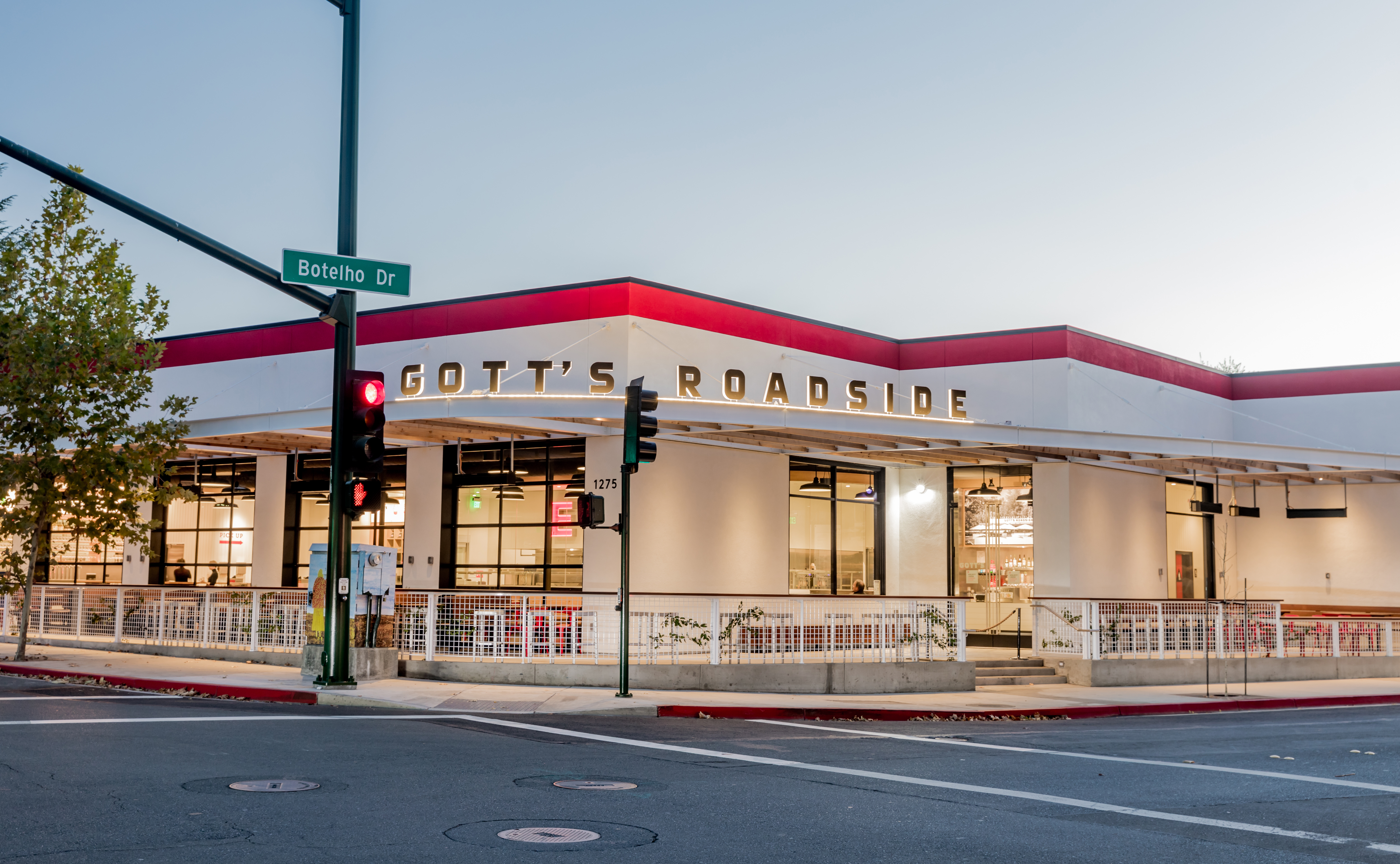 a building with a store on the side of a road