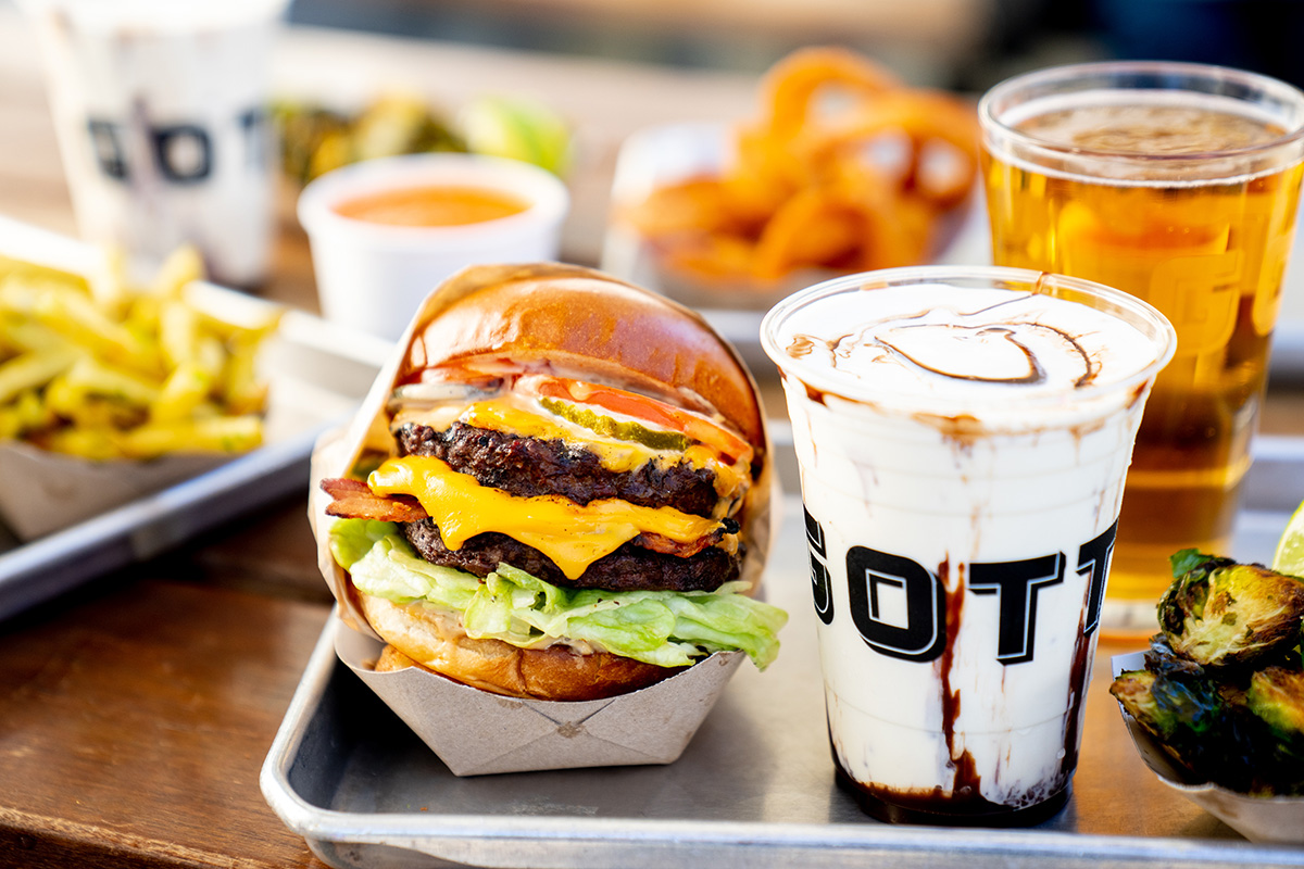 a close up of food on a table next to a cup of coffee