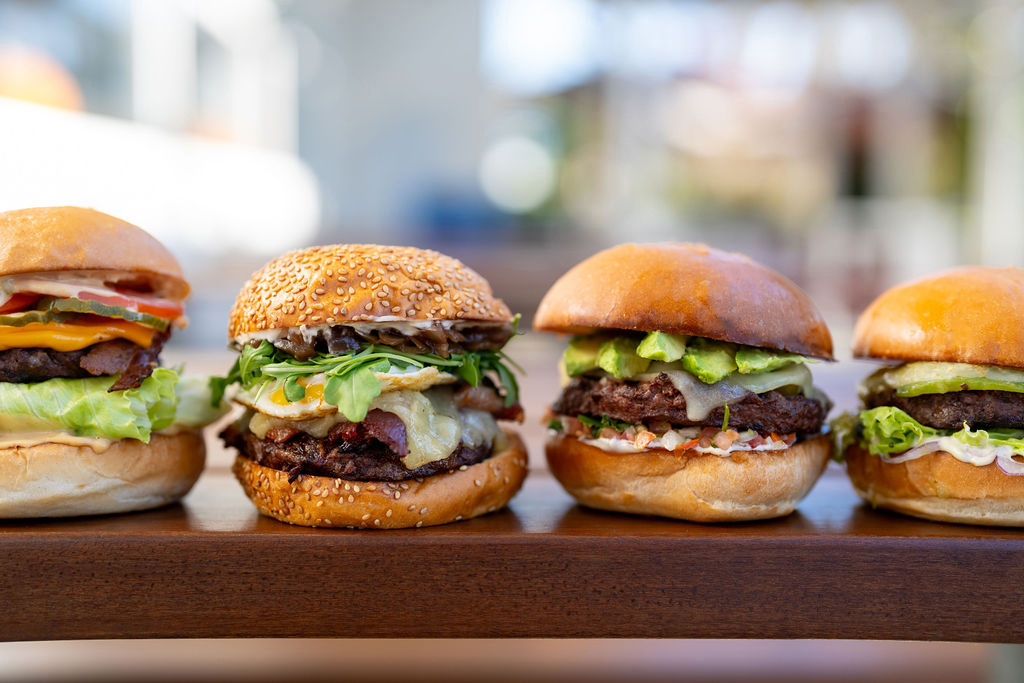 a close up of a sandwich sitting on top of a wooden table