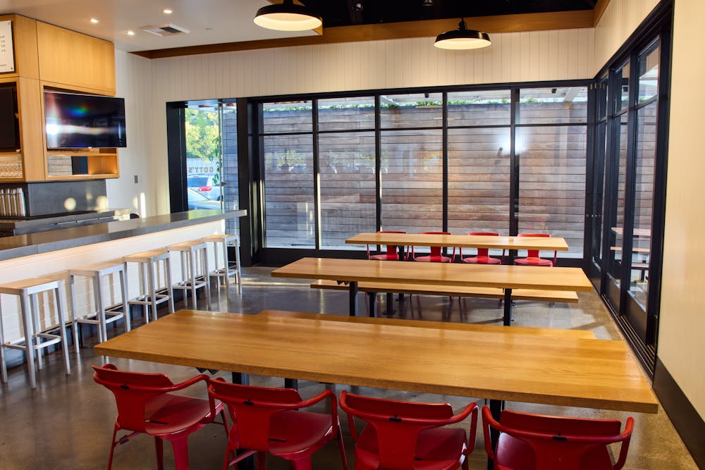 a dining room table in front of a window