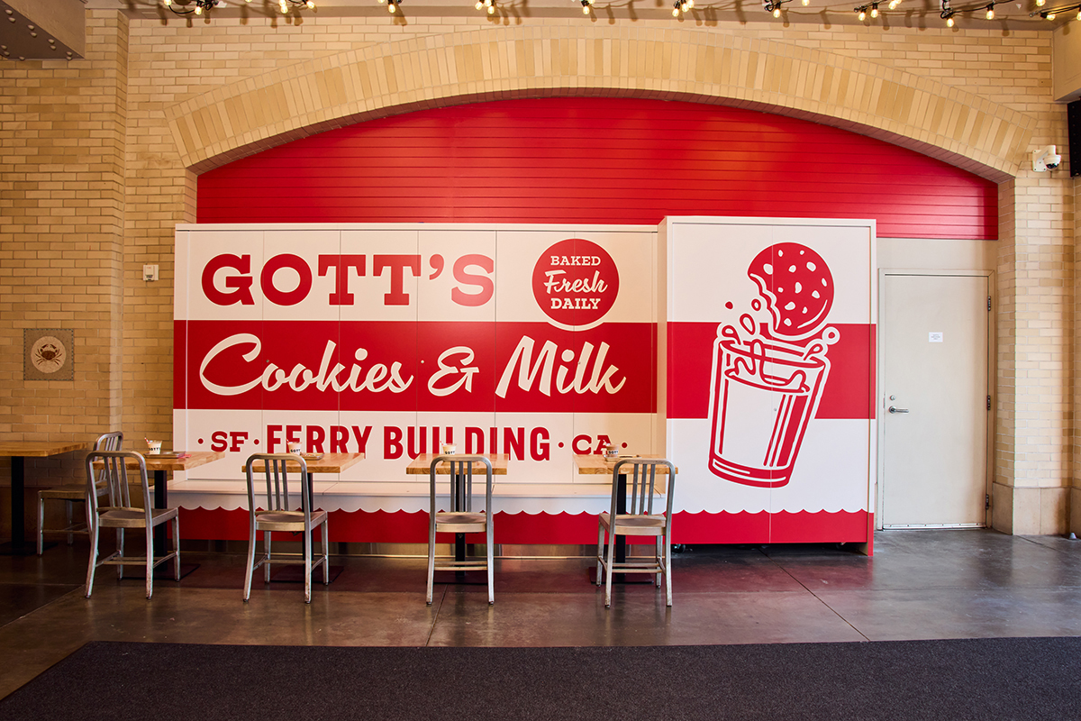Gott's Cookies & Milk mural in front of tables and chairs