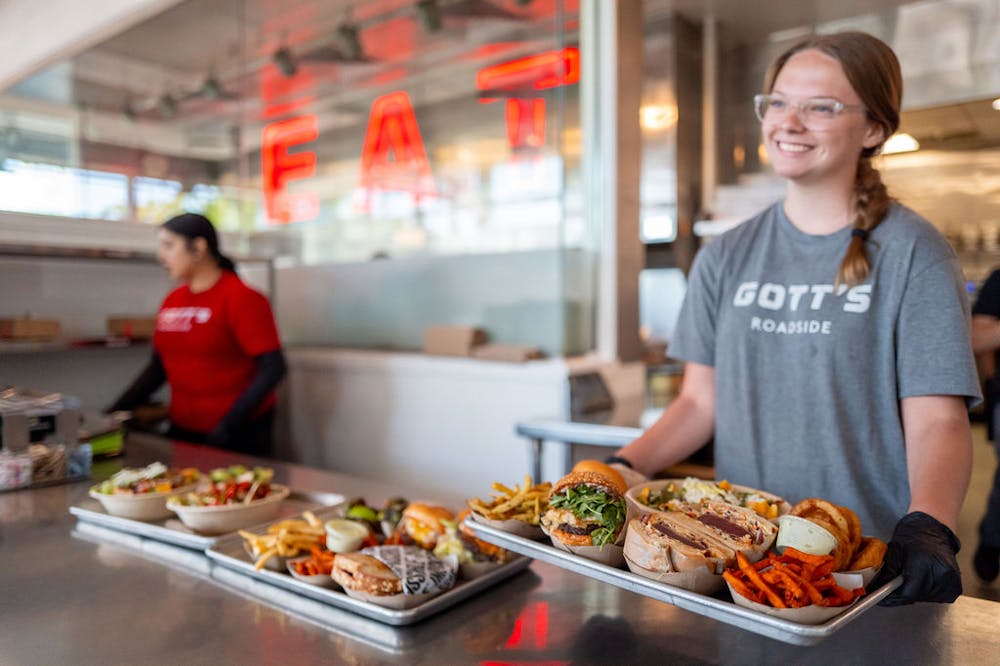a woman preparing food in a restaurant