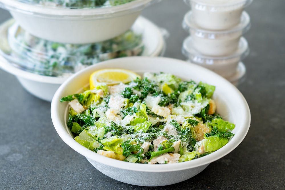 a bowl of food with broccoli