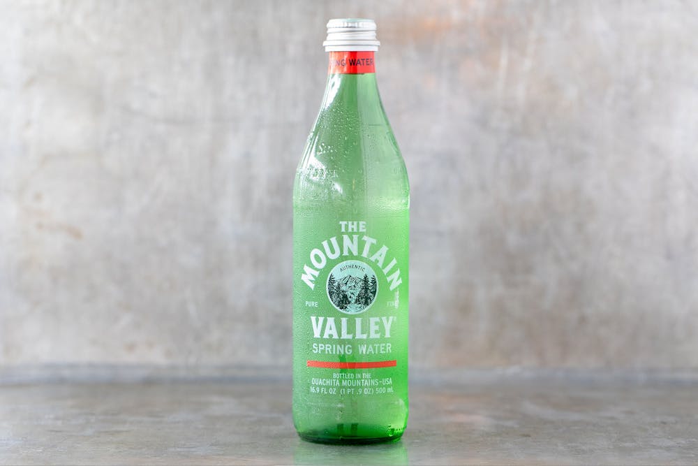 an empty bottle sitting on a table