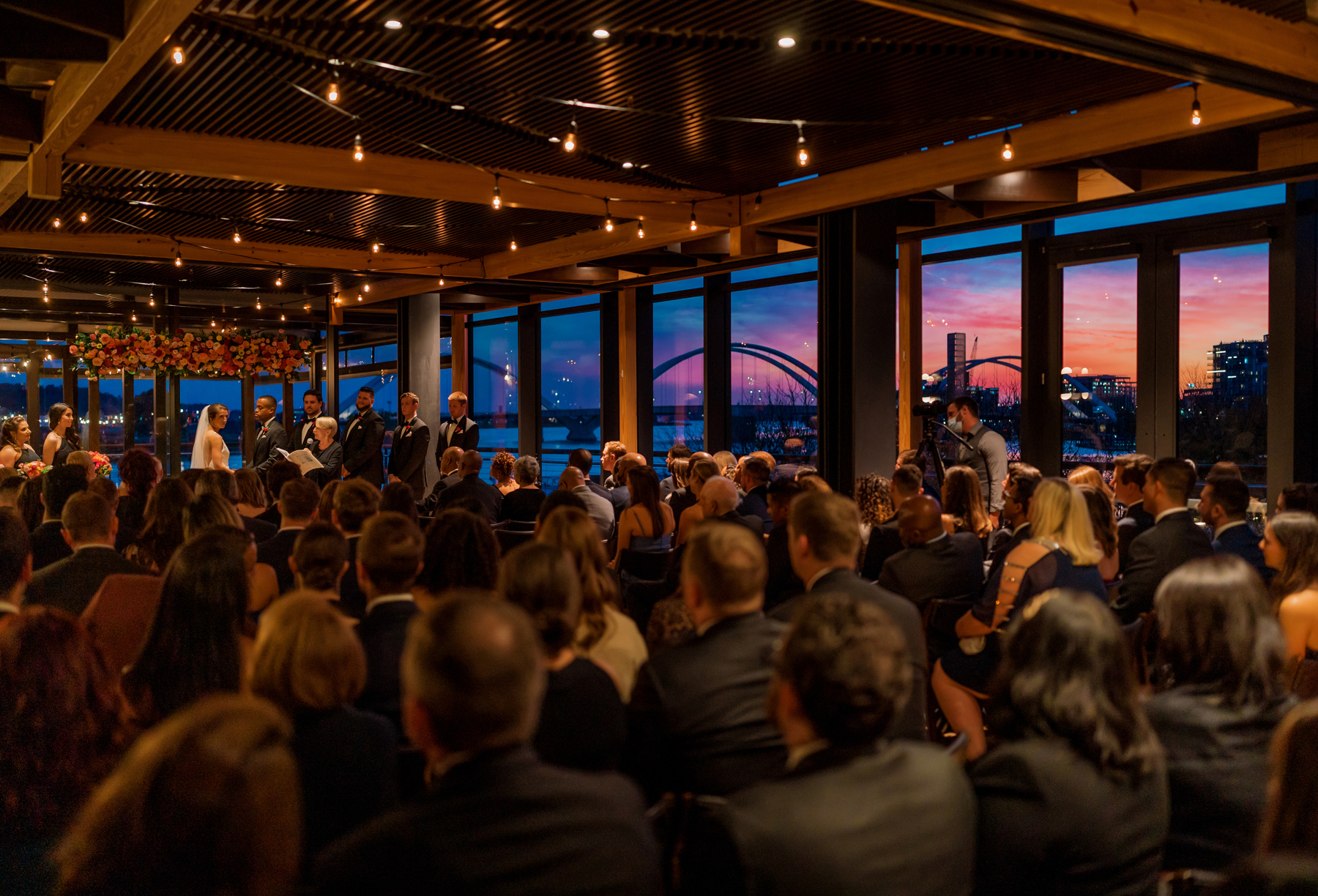 a group of people standing in front of a crowd