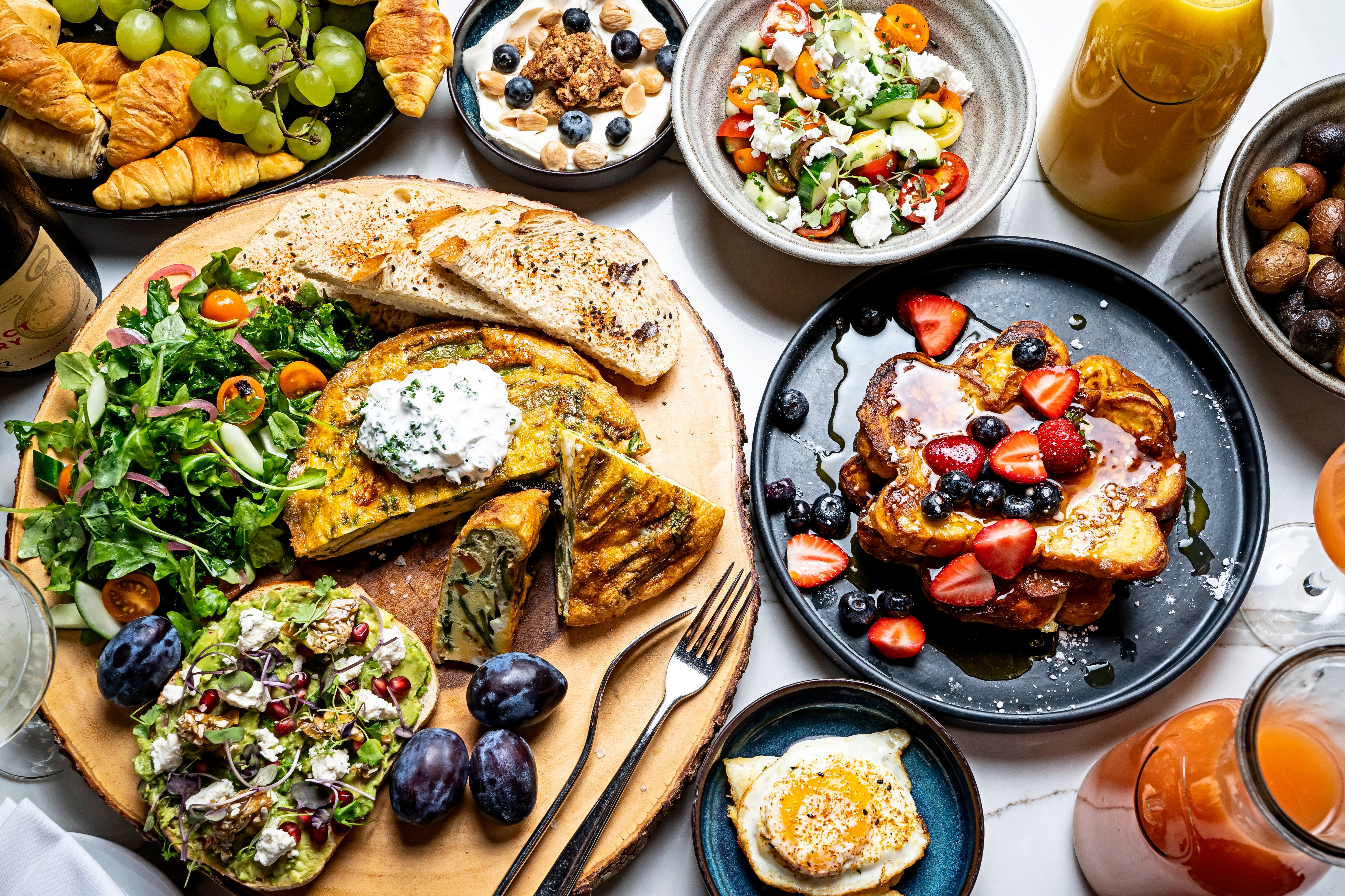 a bunch of different types of food on a table