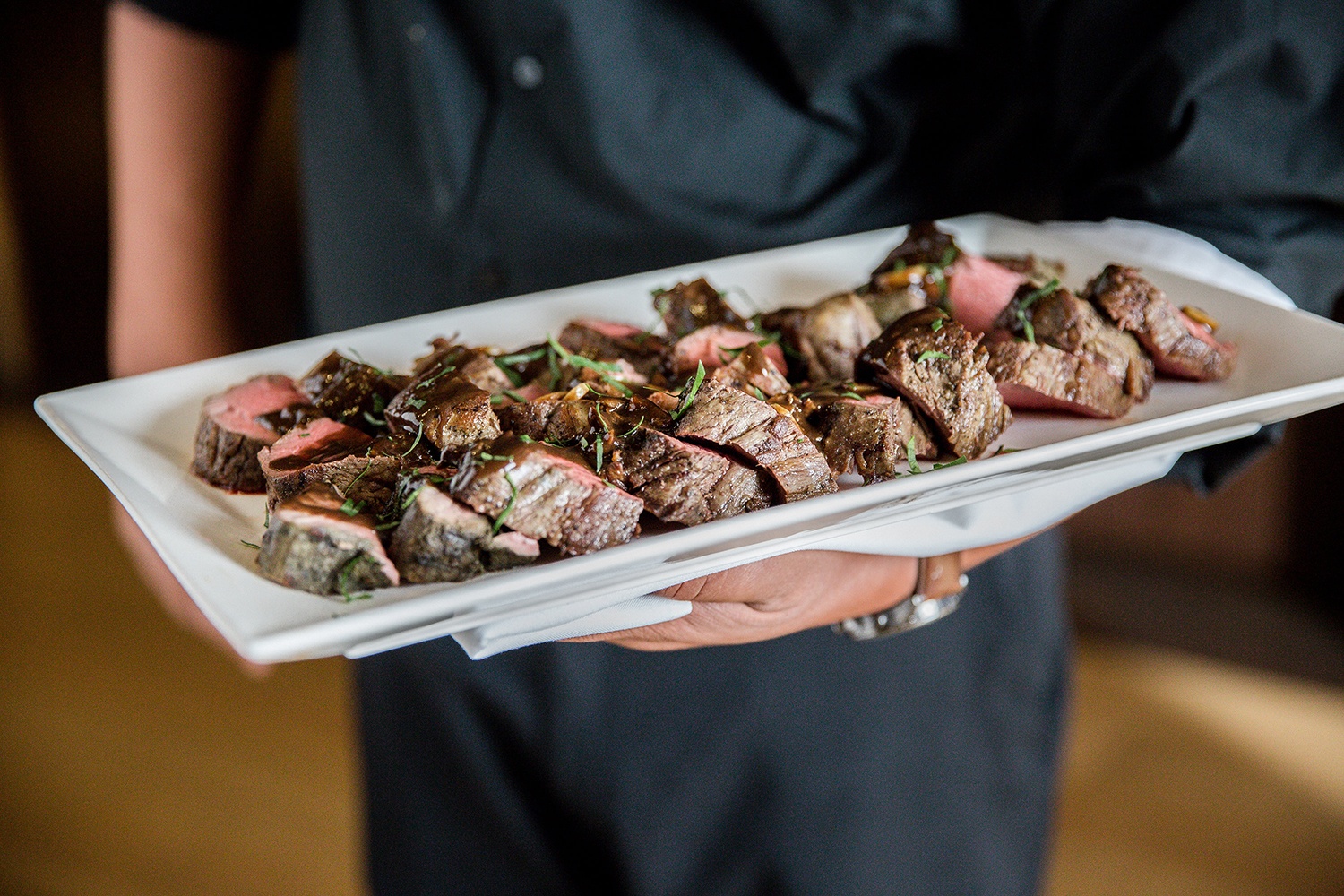 a person holding a plate of food
