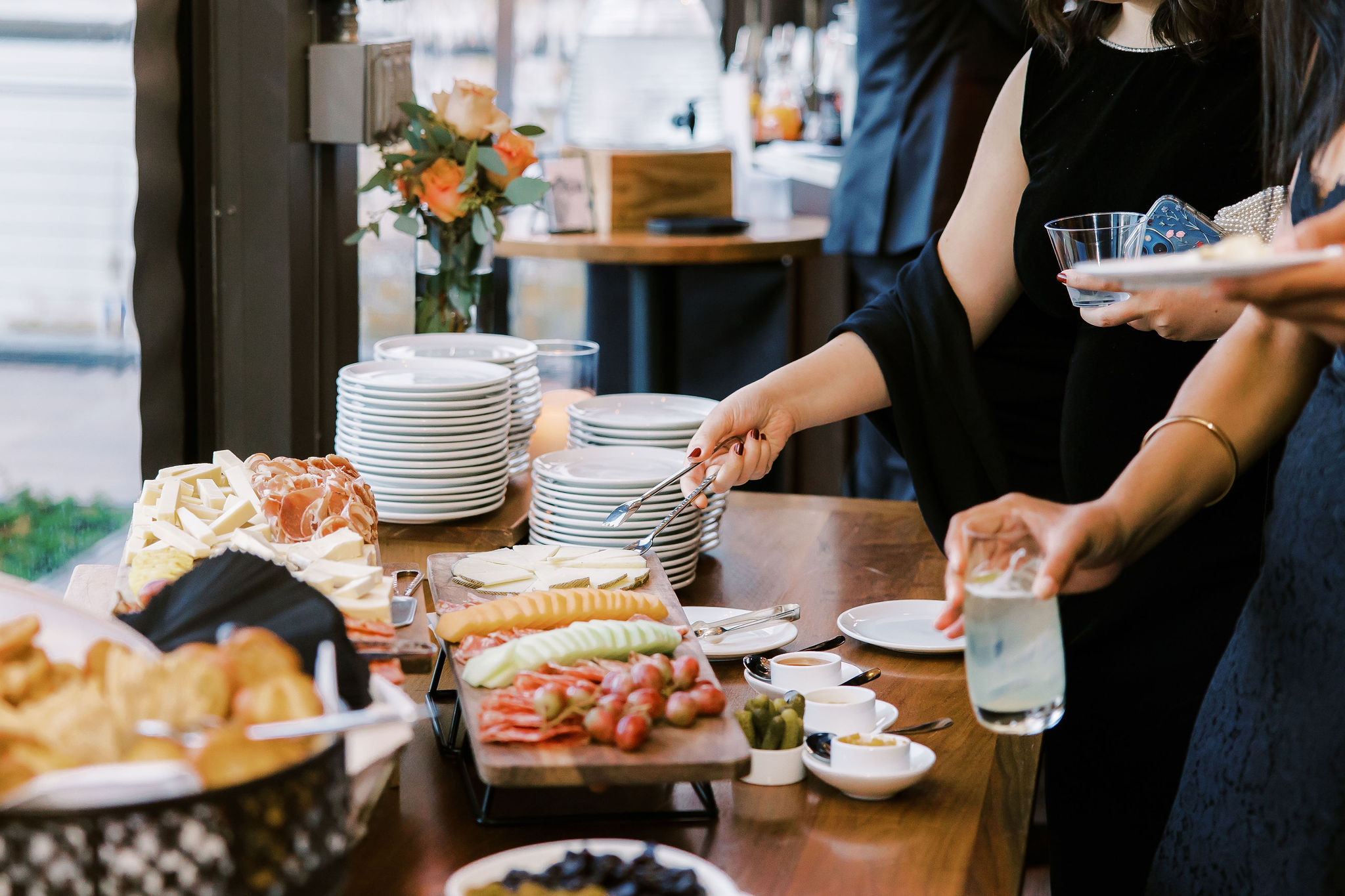 a woman sitting at a table with a plate of food