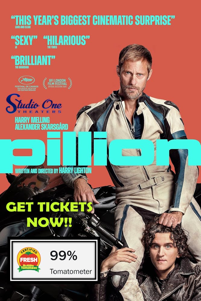 a man sitting on a motorcycle