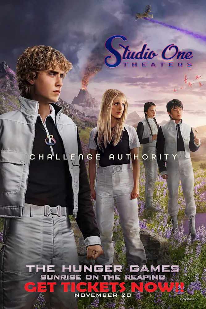 a group of people standing in front of a mountain