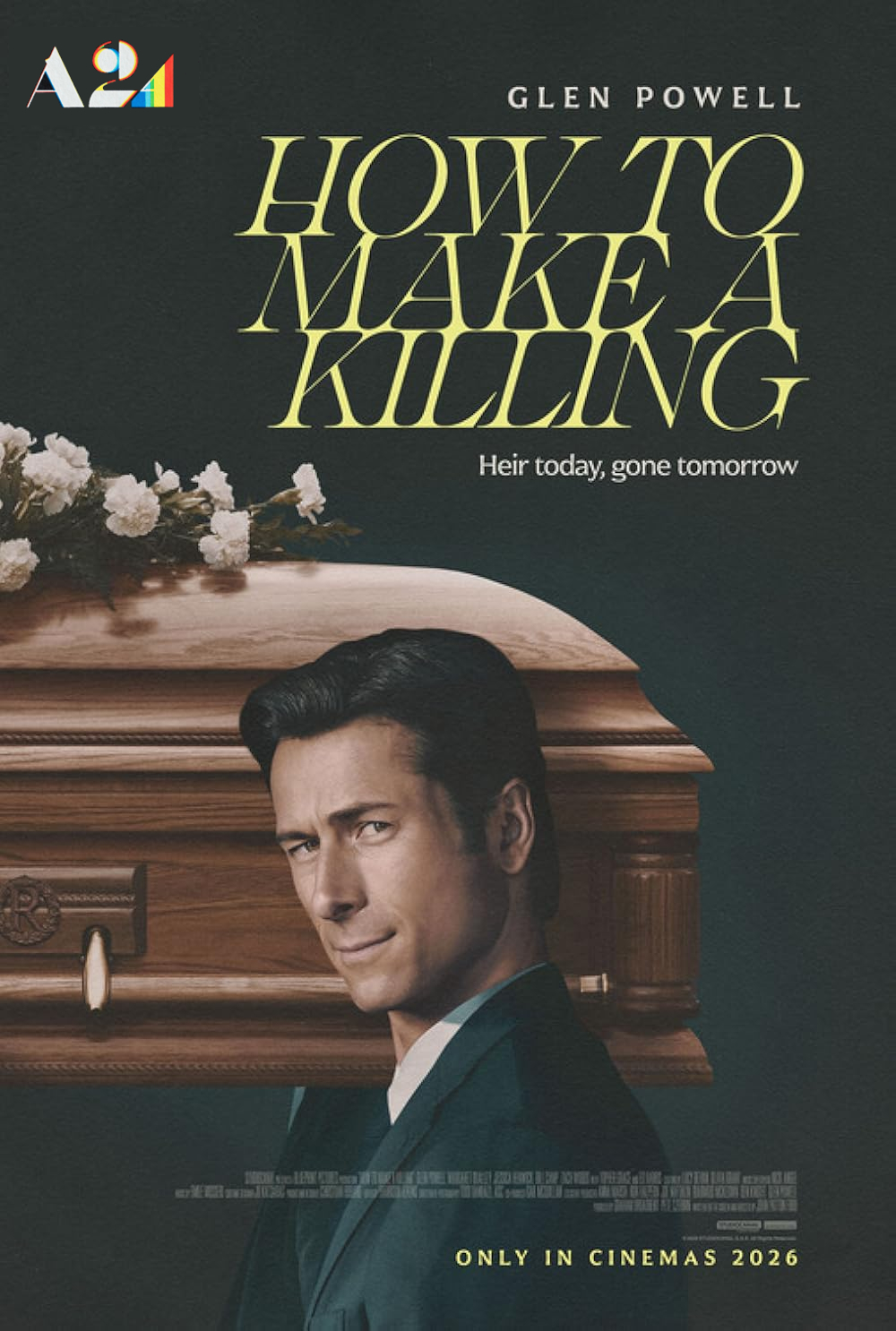 Glen Powell holding a book