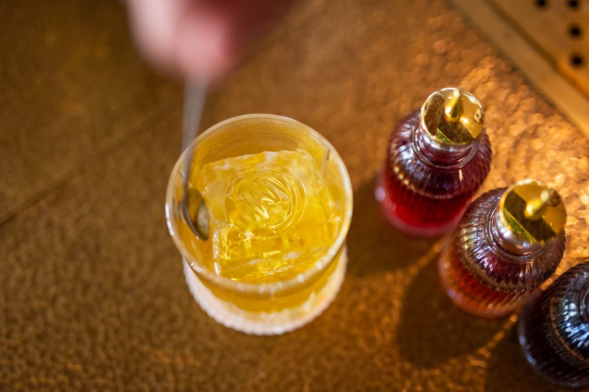 a cocktail being stirred