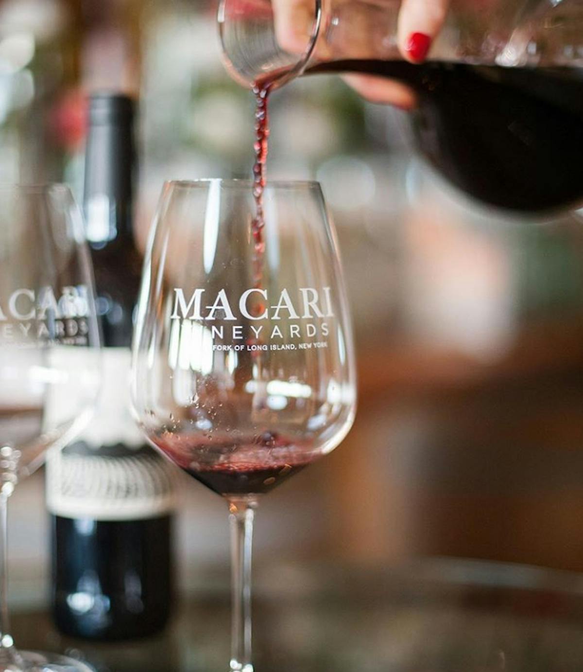 a close up of a bottle and a glass of wine