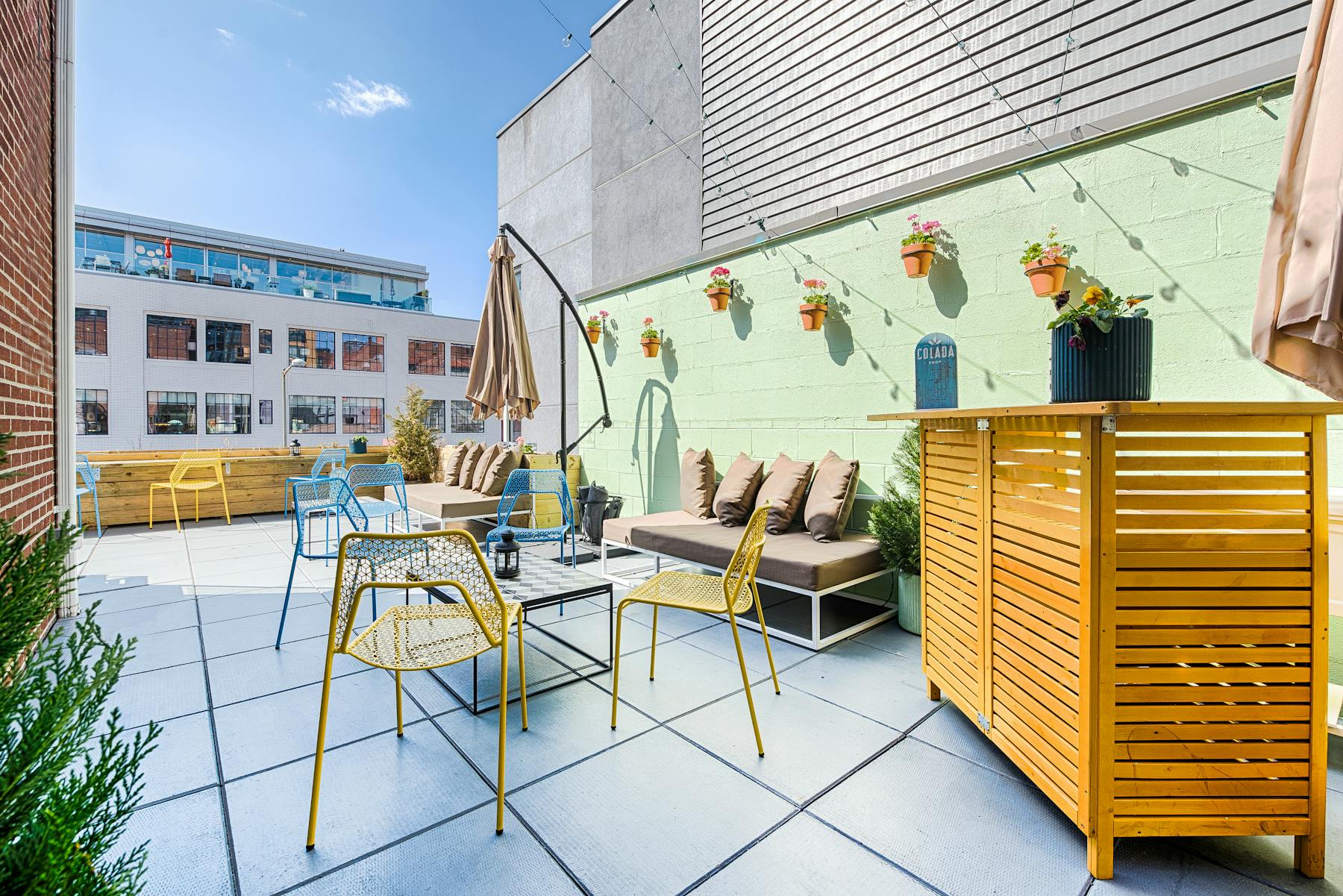 a yellow umbrella sitting on top of a building