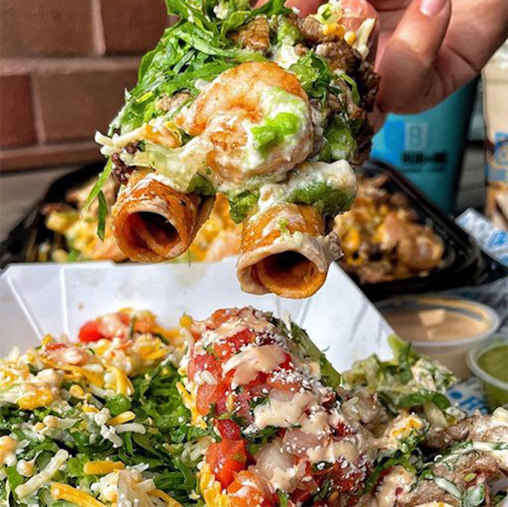 Mexican restaurant prepared a plate of taquitos near Rose Park, Long Beach CA for takeout.