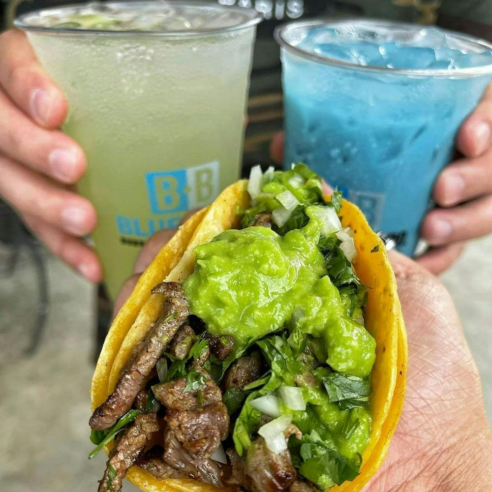 Customer enjoys delightful aguas frescas near Bellflower Blvd & E 7th St, Long Beach, California, from Blue Burro.