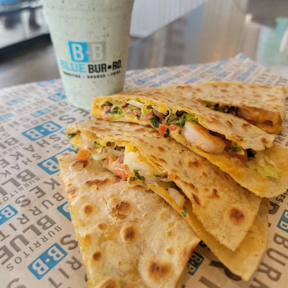 Quesadillas and a shake served by Mexican street food restaurant.