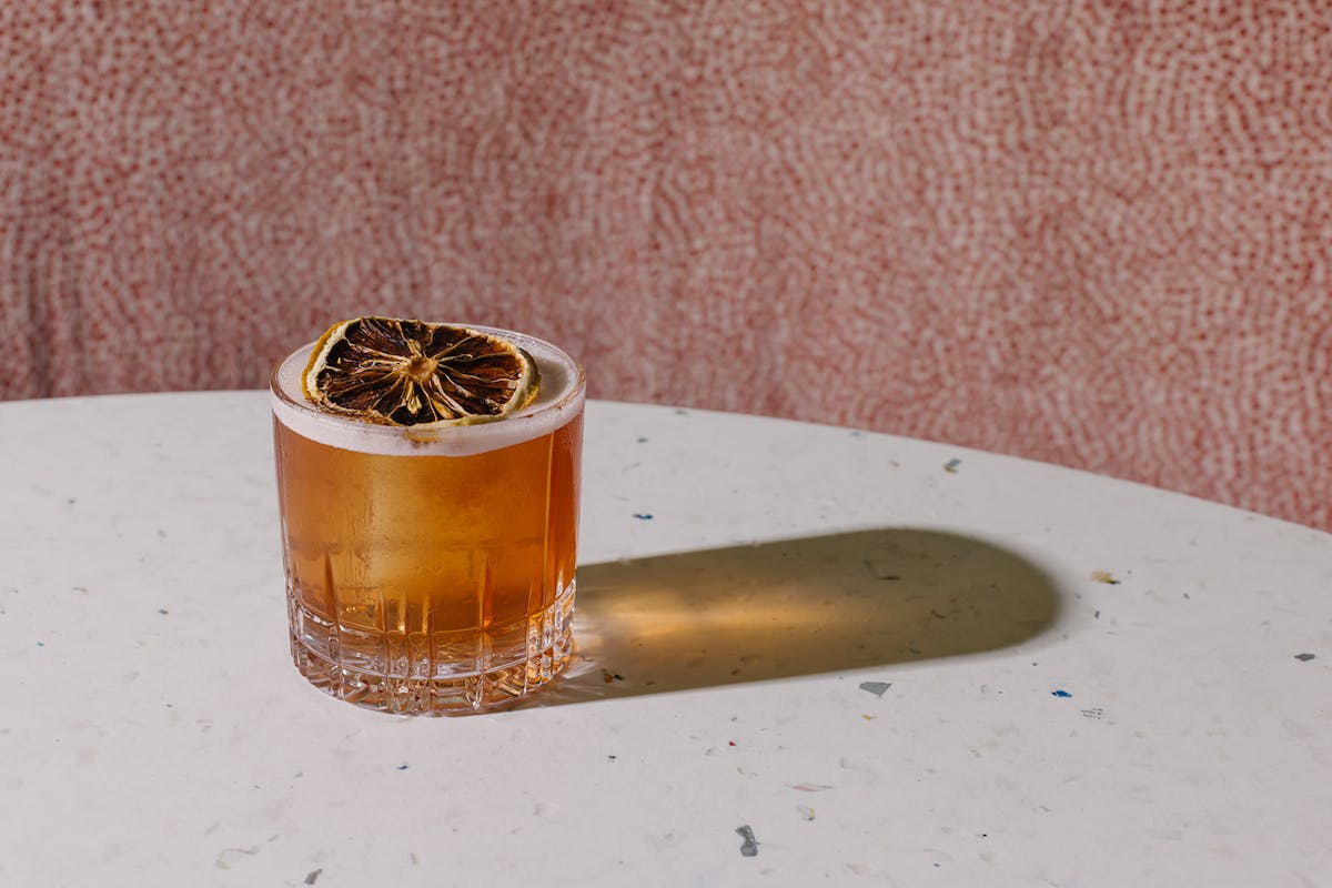 a cocktail sitting on top of a table