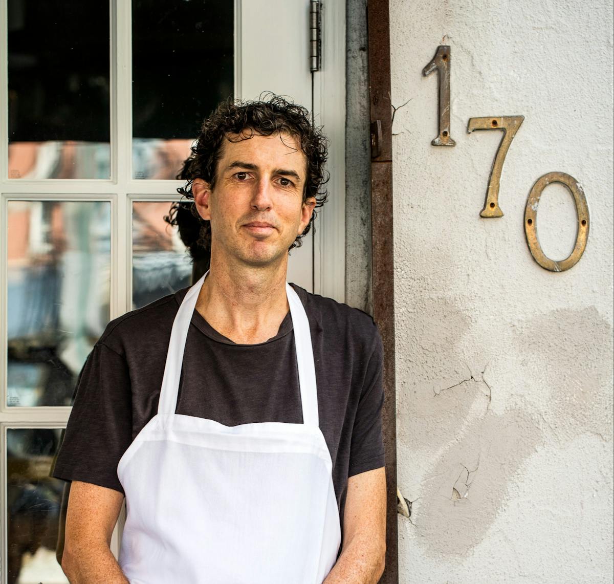 a man standing in front of a building