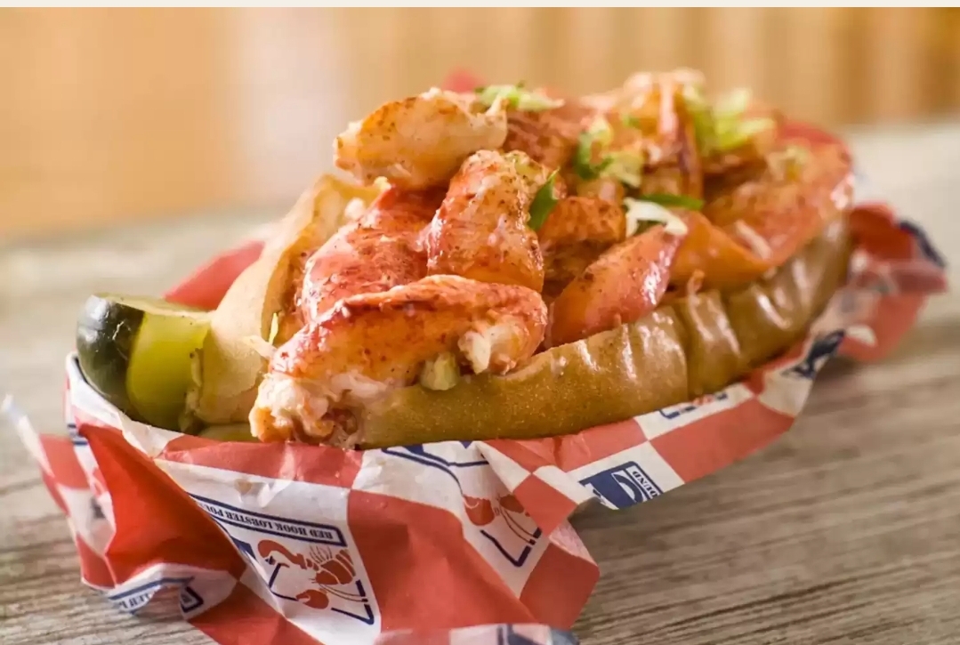 a sandwich sitting on top of a wooden table