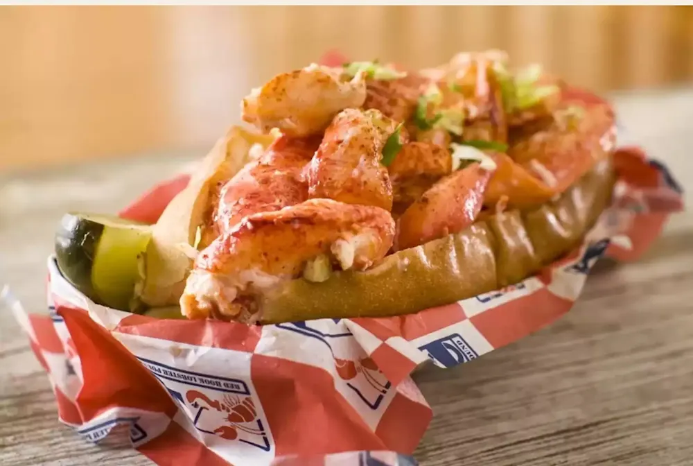 a sandwich sitting on top of a wooden table