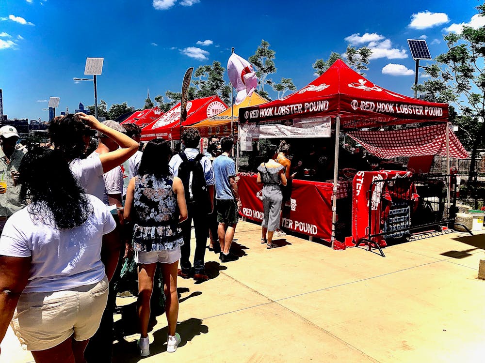 a group of people standing in front of a crowd posing for the camera