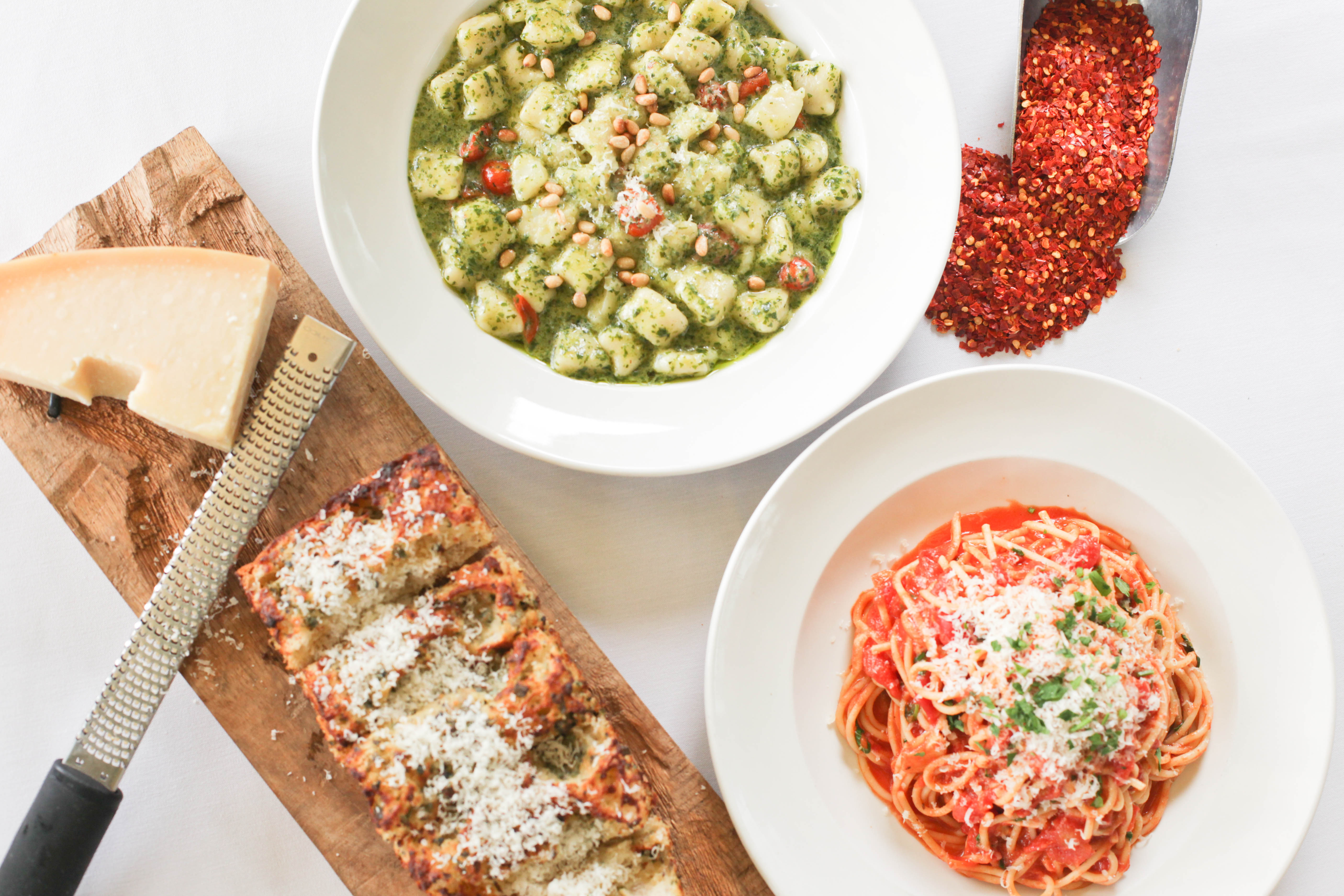 a plate of food with a slice of pizza