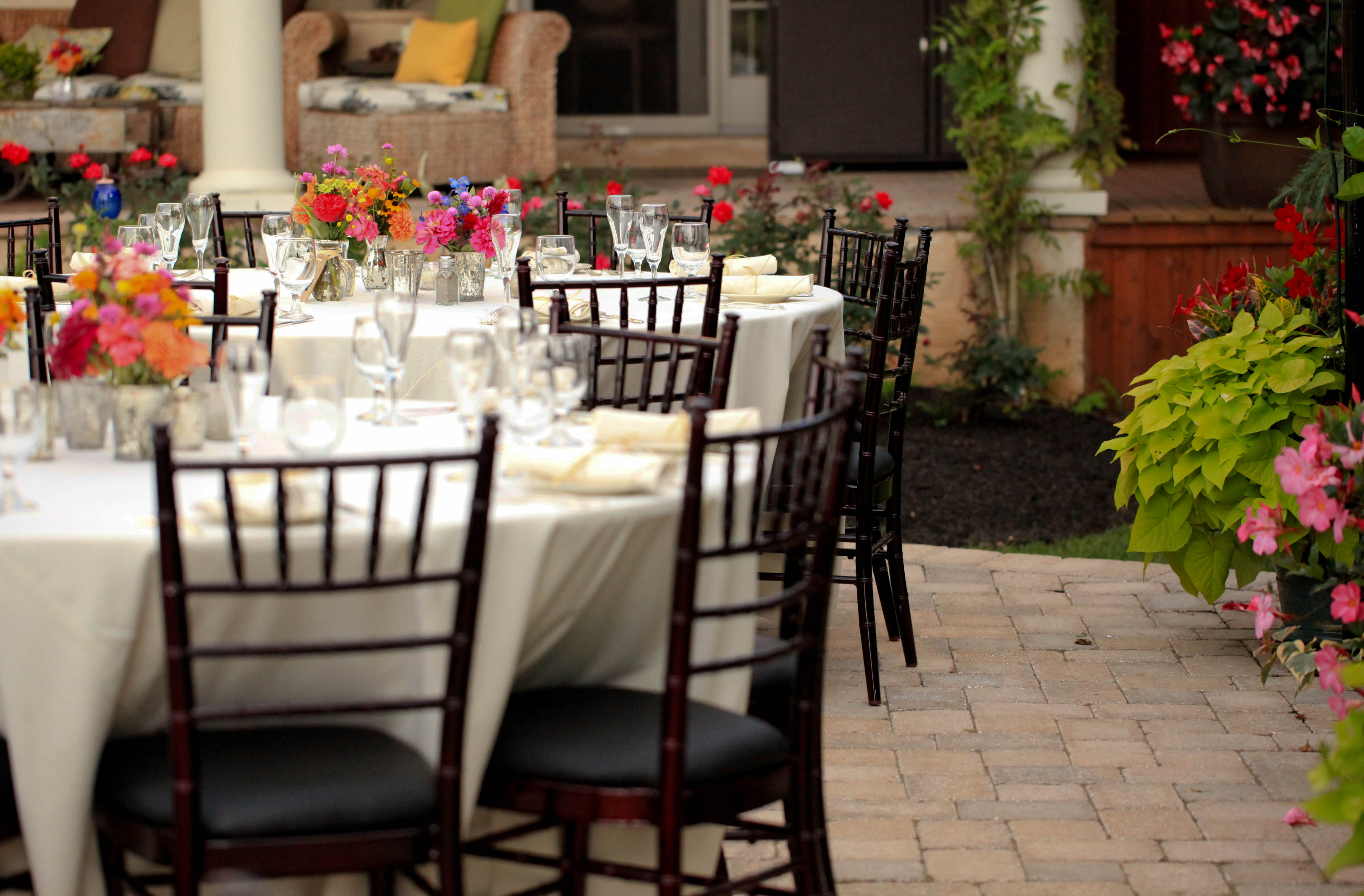a vase of flowers on a dining table