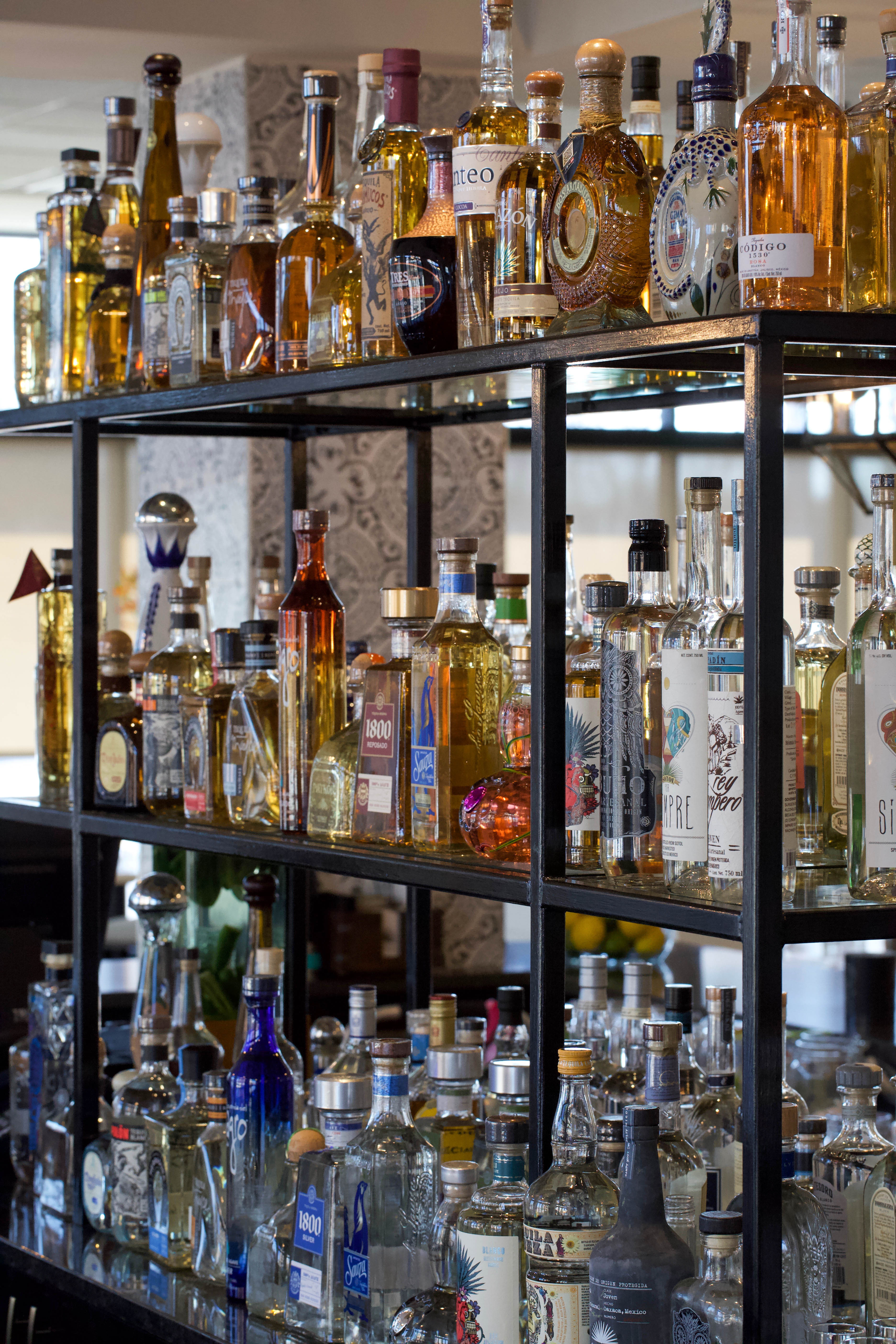 a store shelf filled with wine glasses