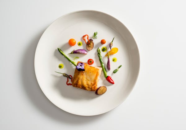 Catering Menu Front Page with Sea Bass and Seasonal Veggies like Asparagus