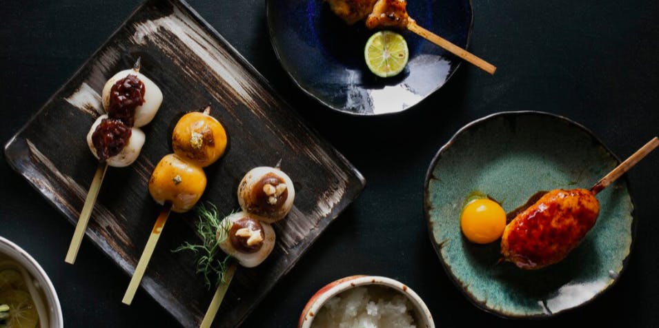 a bunch of food sitting on top of a wooden table