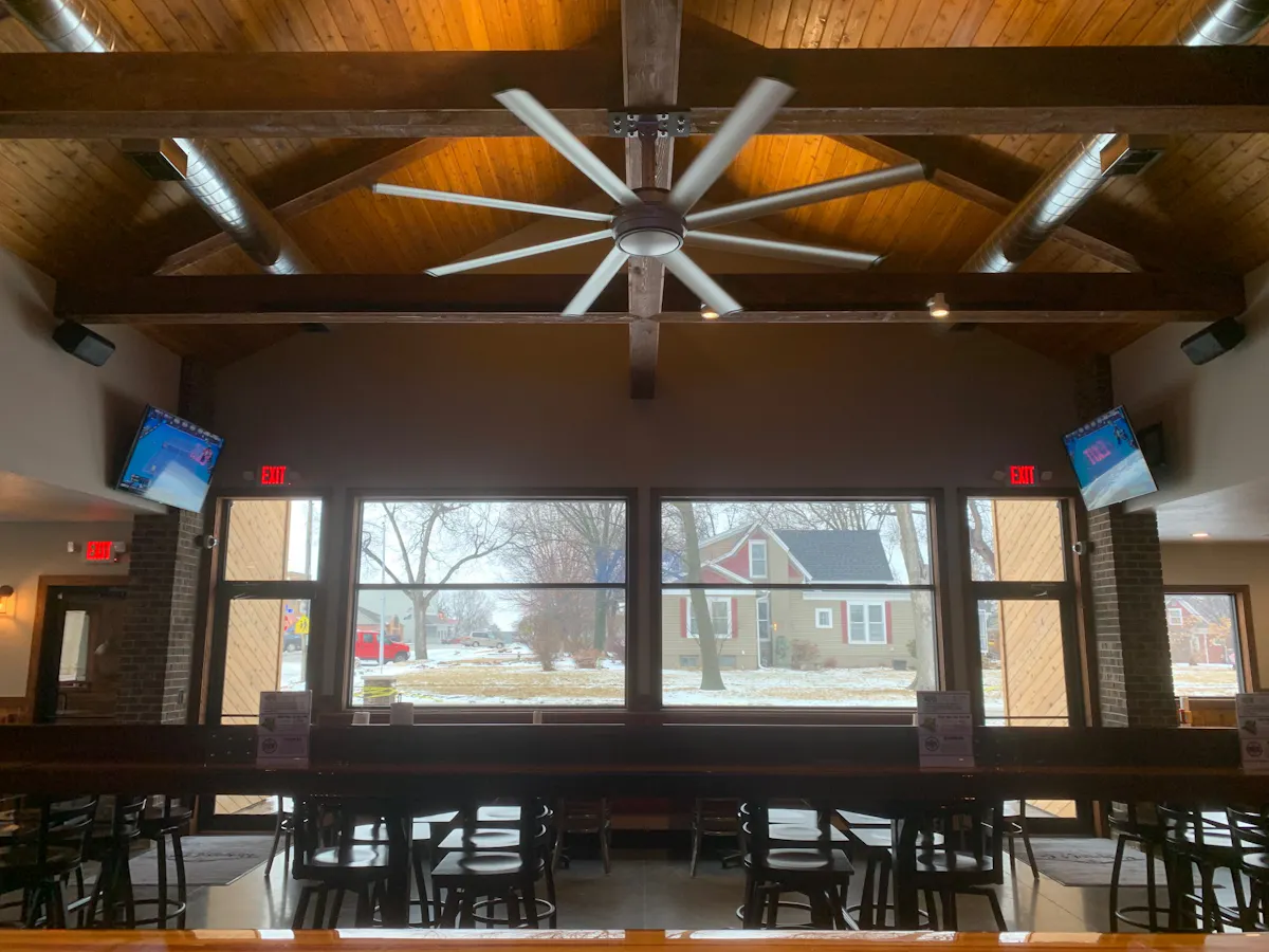 interior of the restaurant with windows in front