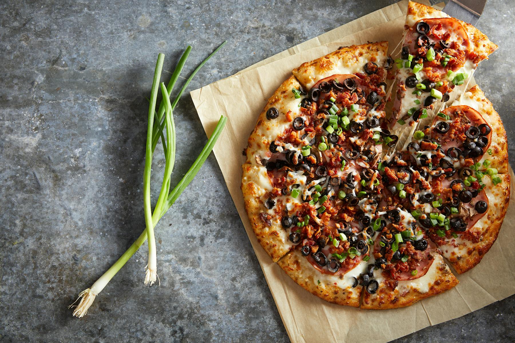 a pizza sitting on a tray