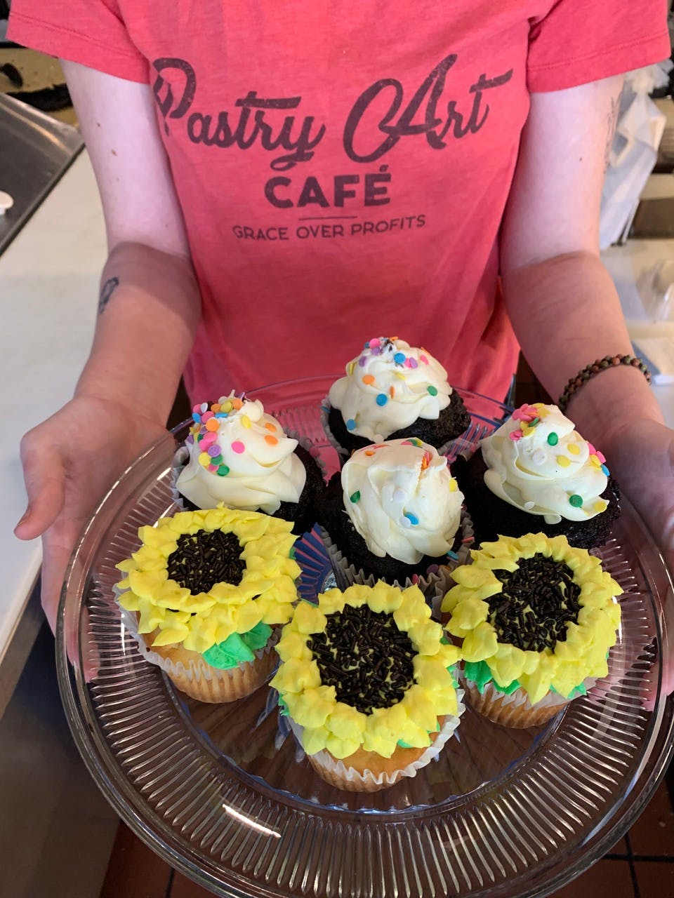 a person sitting at a table with a cake