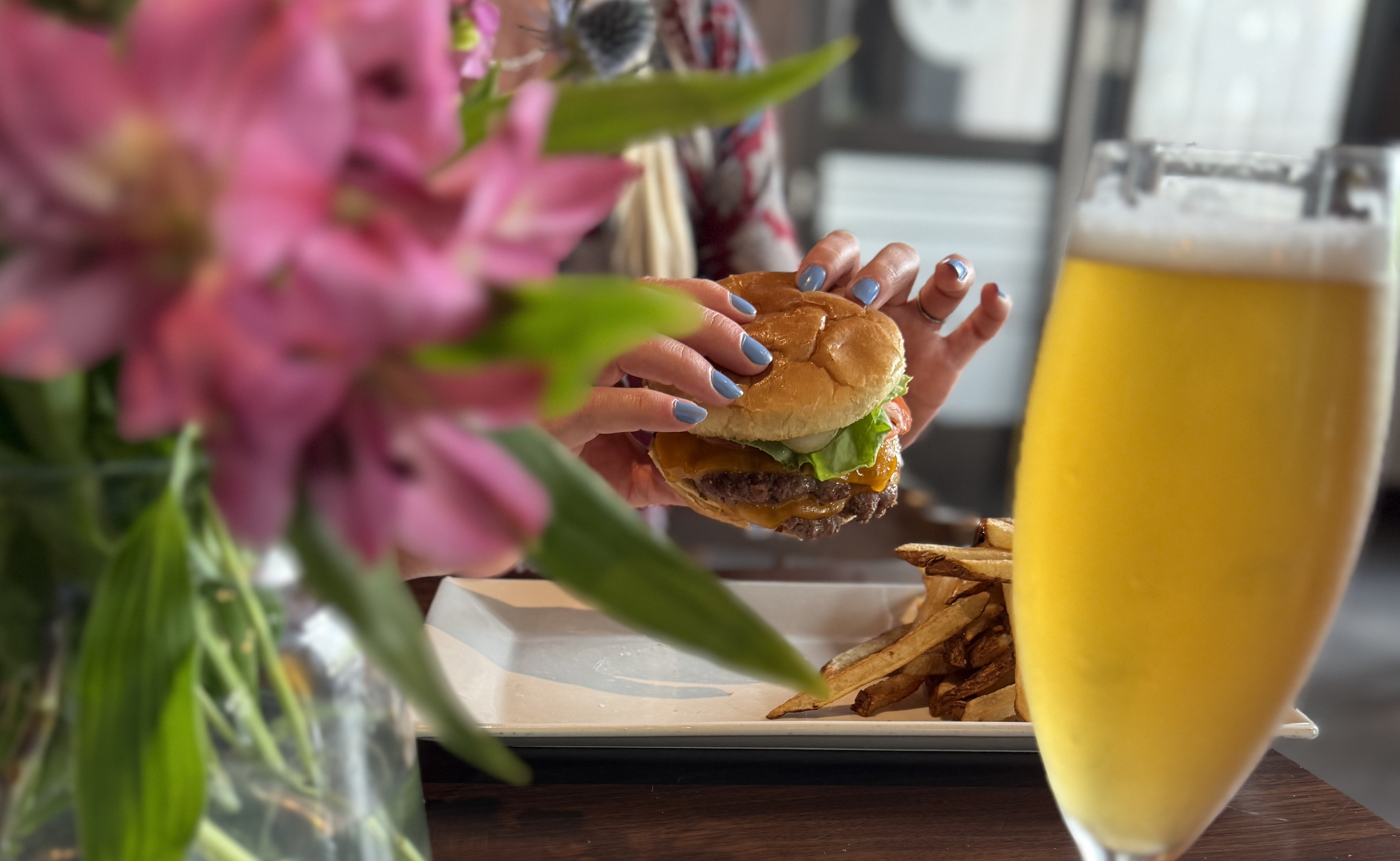 woman holding smash burger