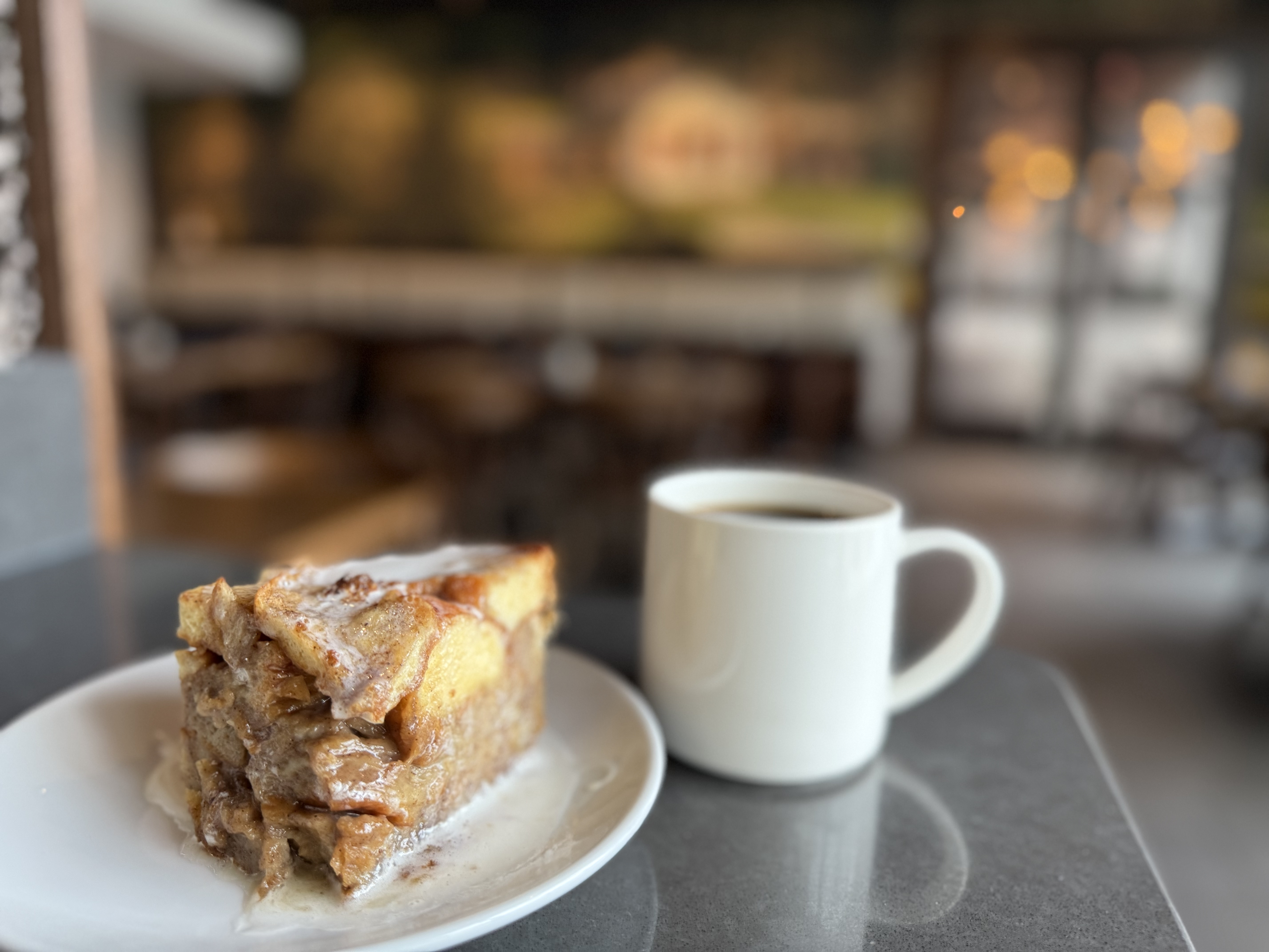a close up of a plate of food and a cup of coffee