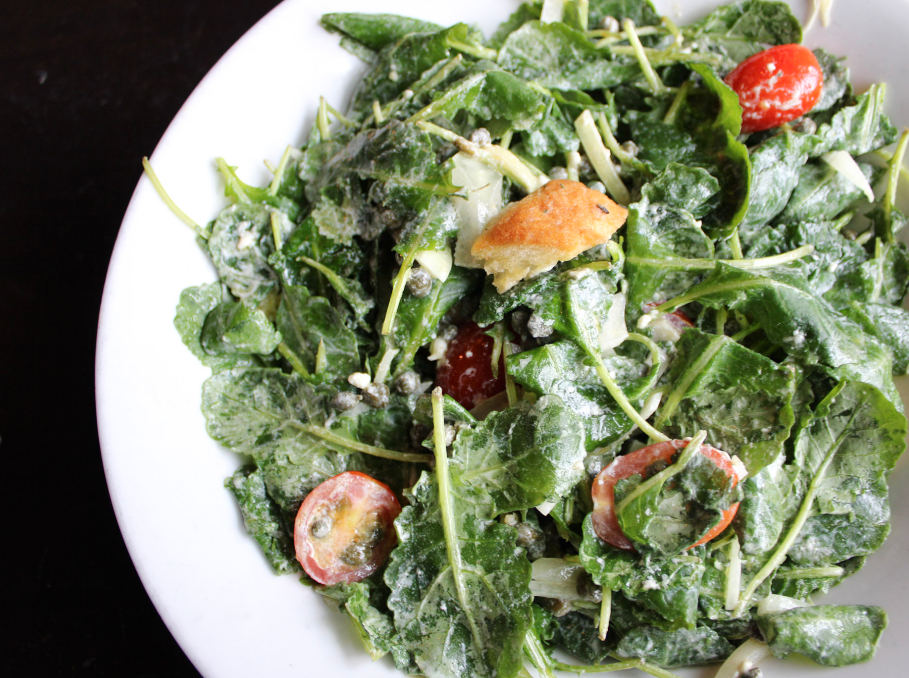 a bowl of salad on a plate