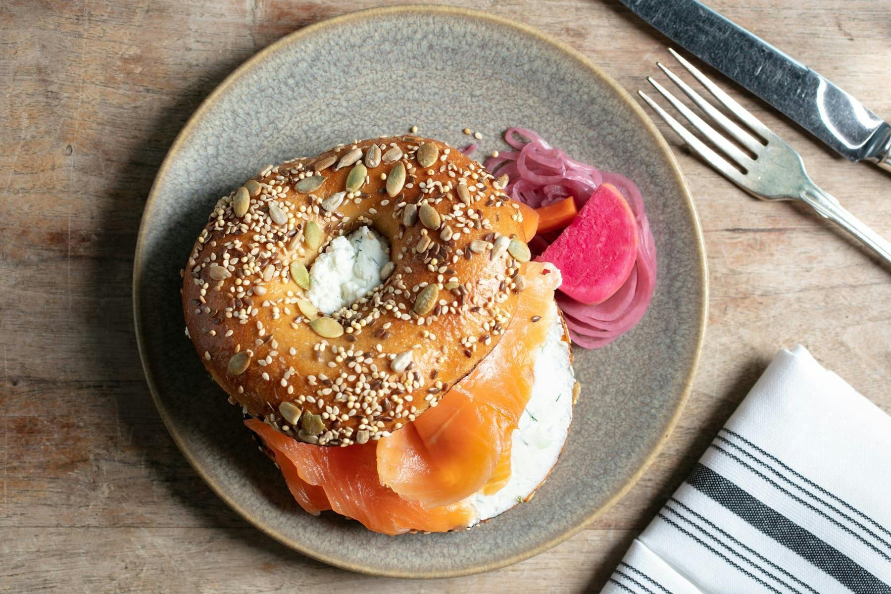 a BAGEL sitting on top of a wooden table