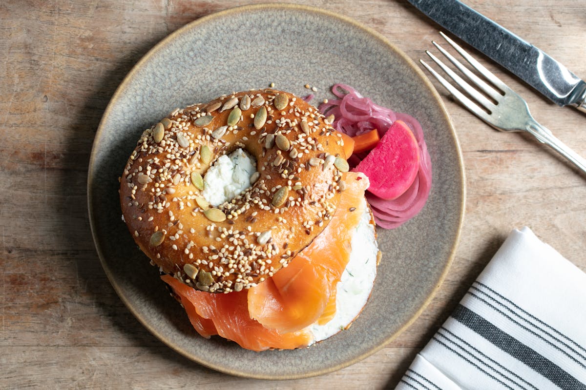 a donut sitting on top of a wooden table