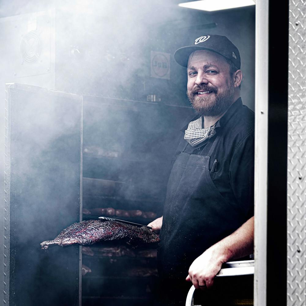 Pitmaster Robert Sonderman of Federalist Pig tends to the grill