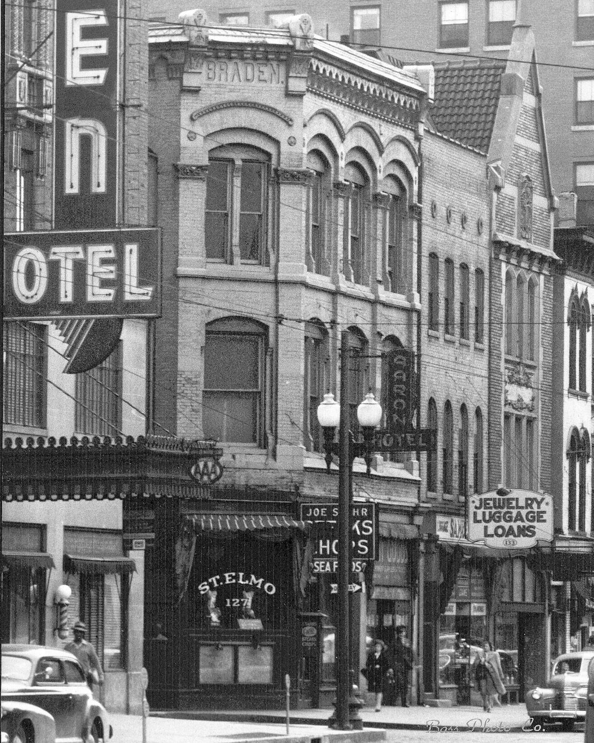 an old photo of a busy city street