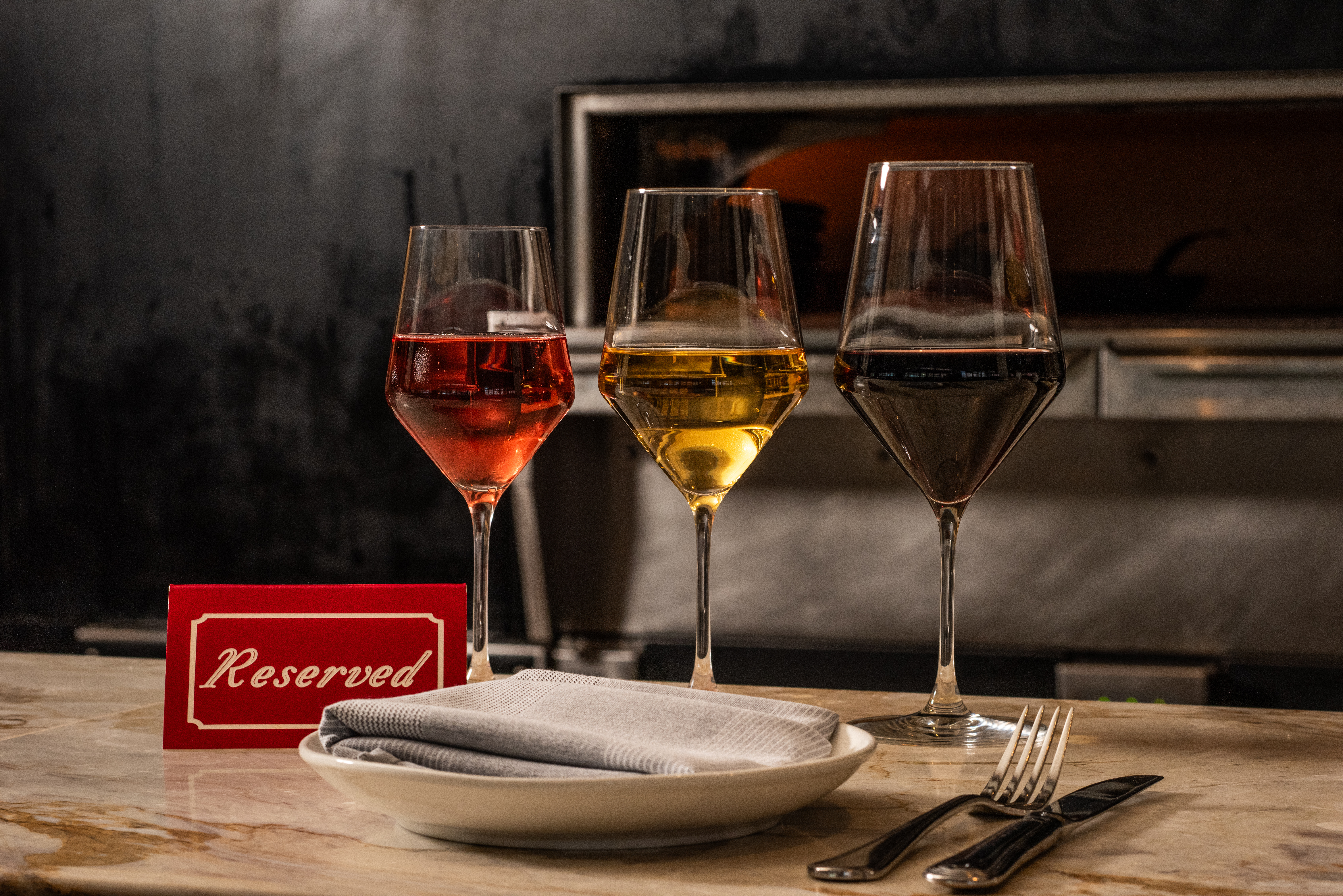 a group of wine glasses on a table